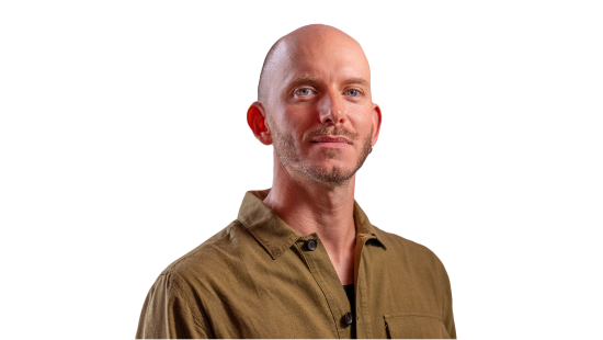 Headshot of Alessandro Coatti wearing tan coloured shirt